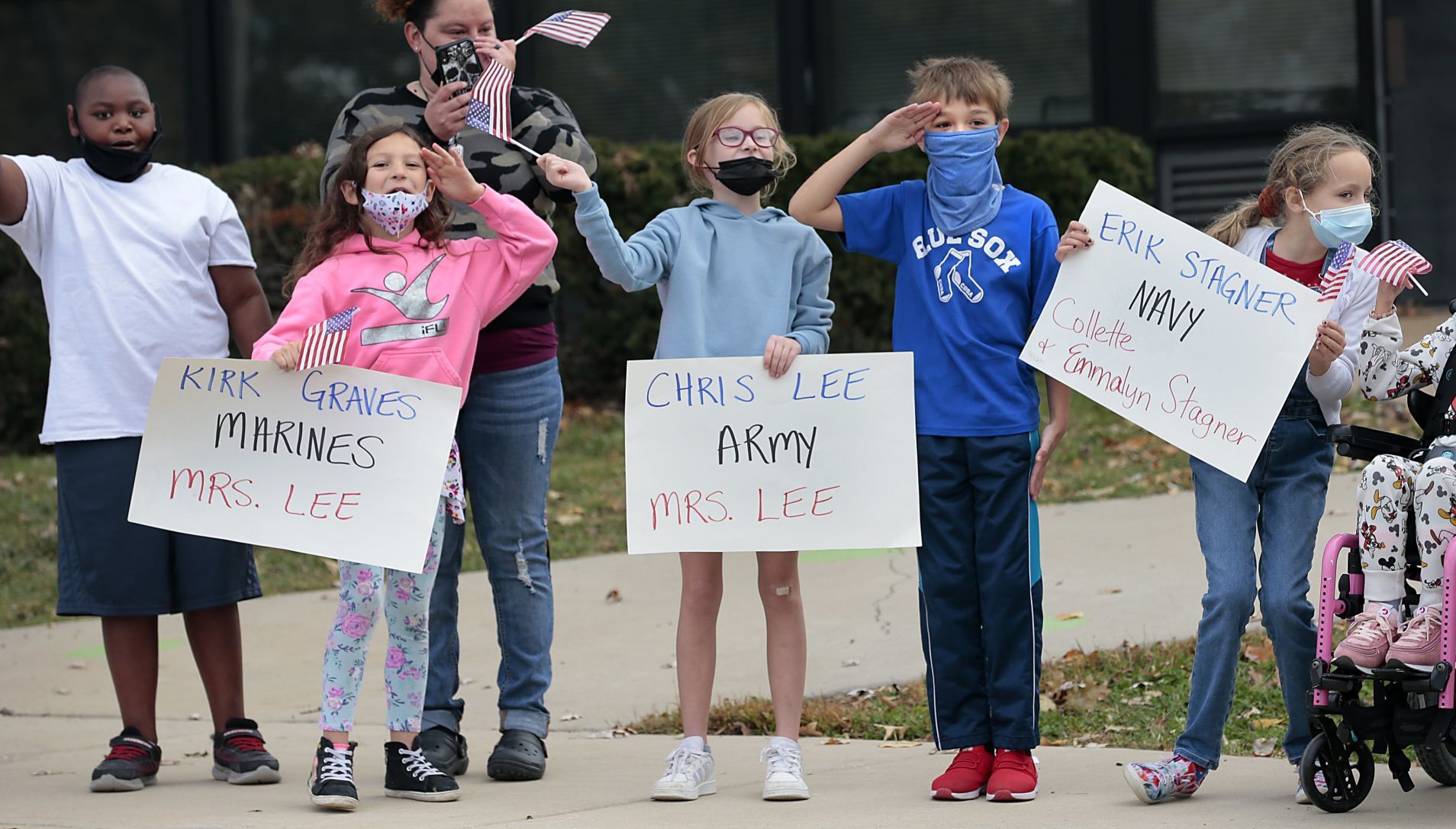 Students honor veterans with drive-by parade